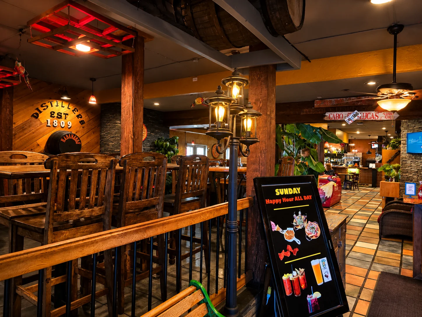 Bar and lounge seating with rustic wood tables at Habaneros Mexican Grill in Leduc, AB